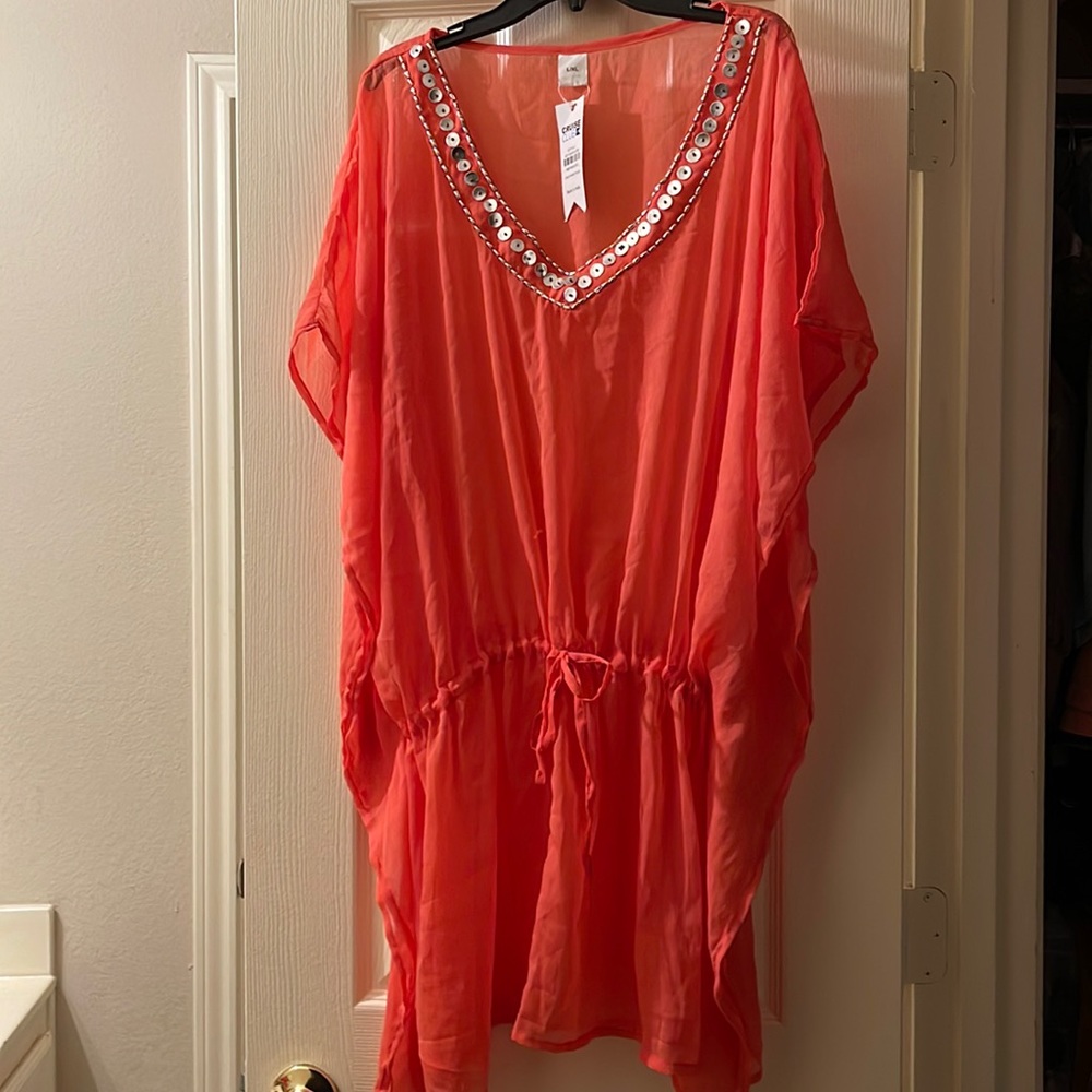 Bathing beauty: water or land. Slip on a cami (not included) and wear all summer